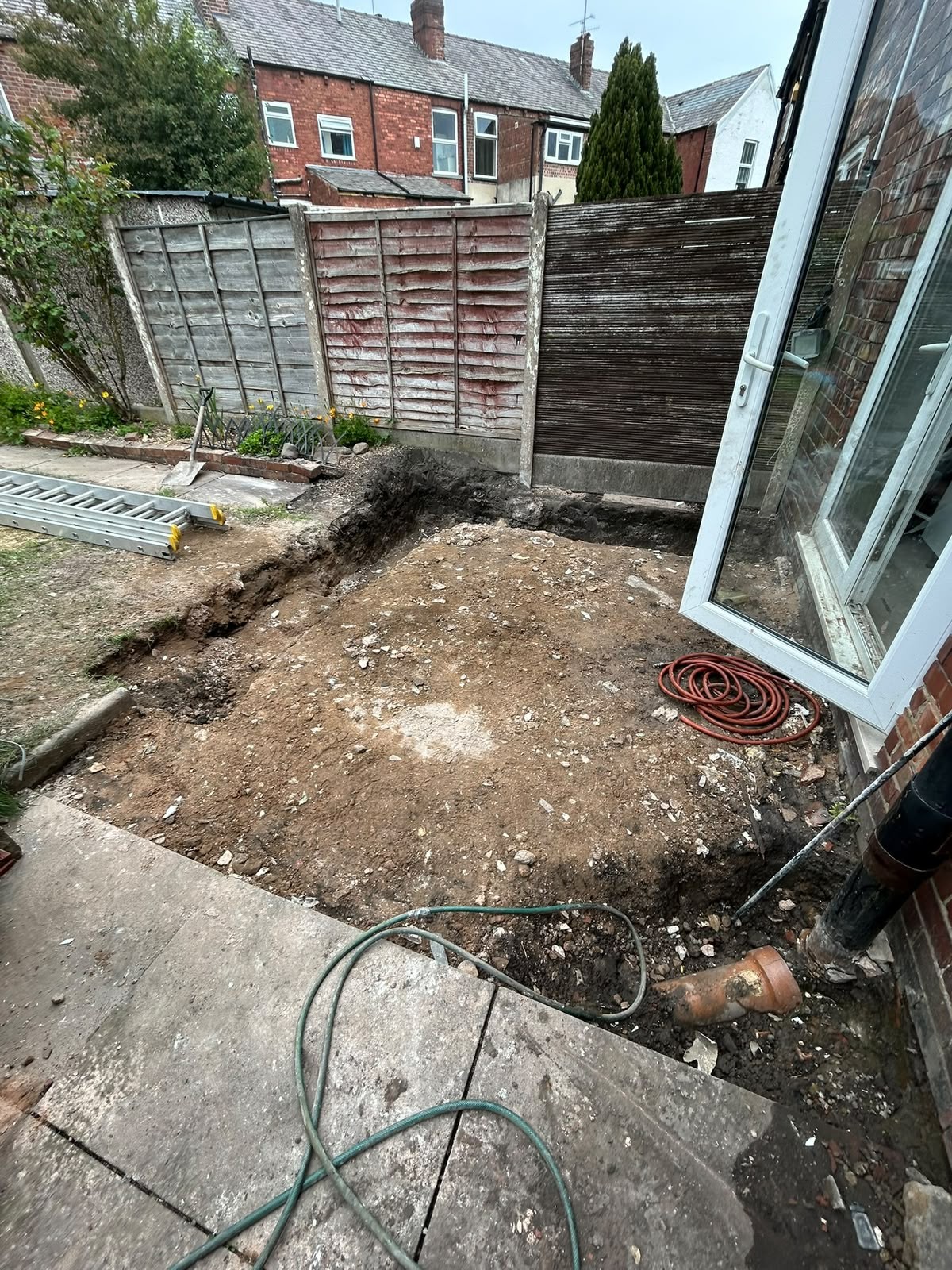 Manchester rear yard excavated back to soil after paving and slabs were stripped out and removed