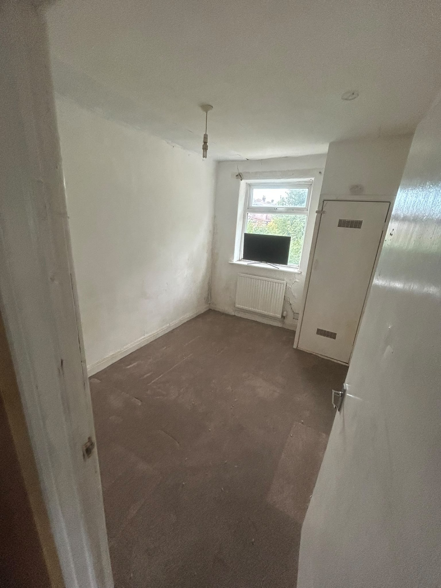 Manchester bedroom stripped back to bare floor and plastered walls after a property strip out