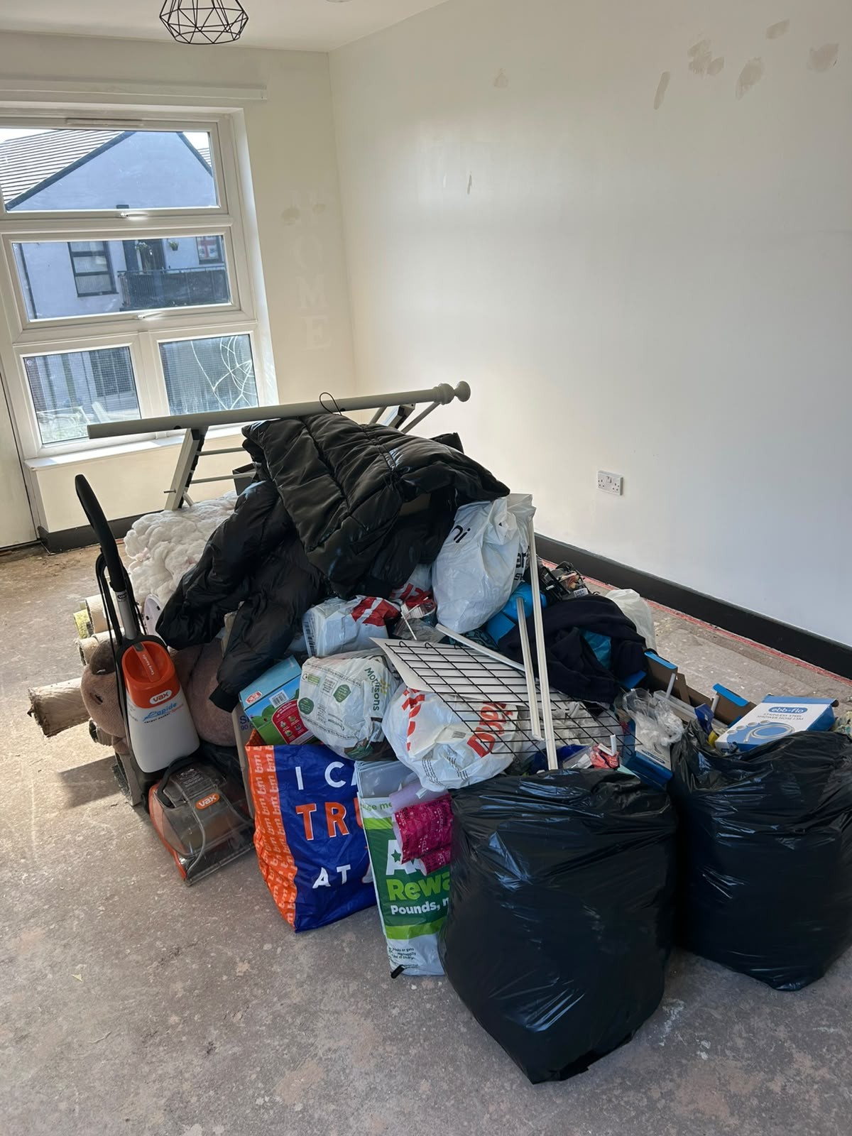 Household waste bagged and stacked in a Manchester property ready for removal during a large clearance