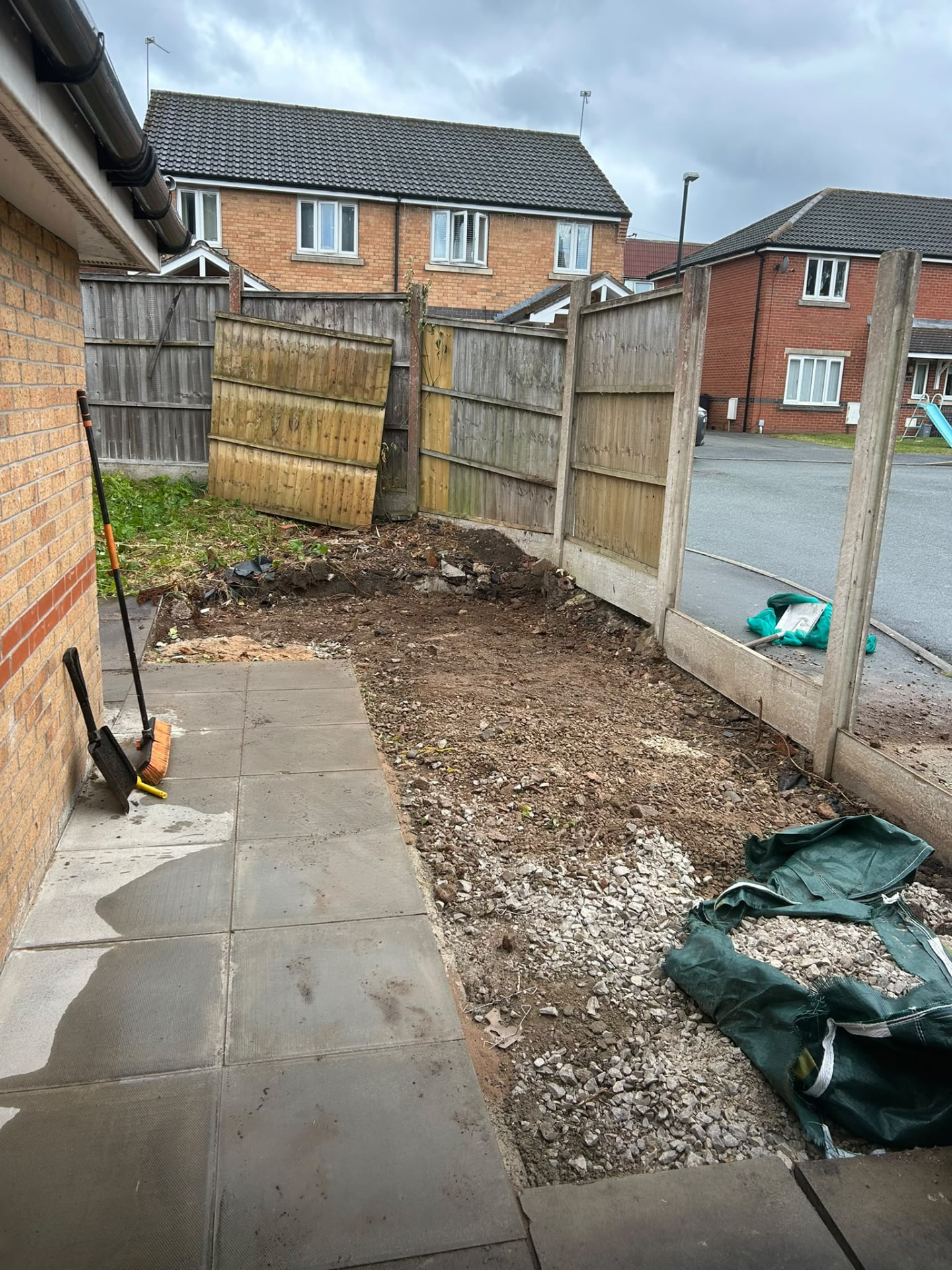 Manchester garden broken out to bare ground with rubble bagged during a property strip out